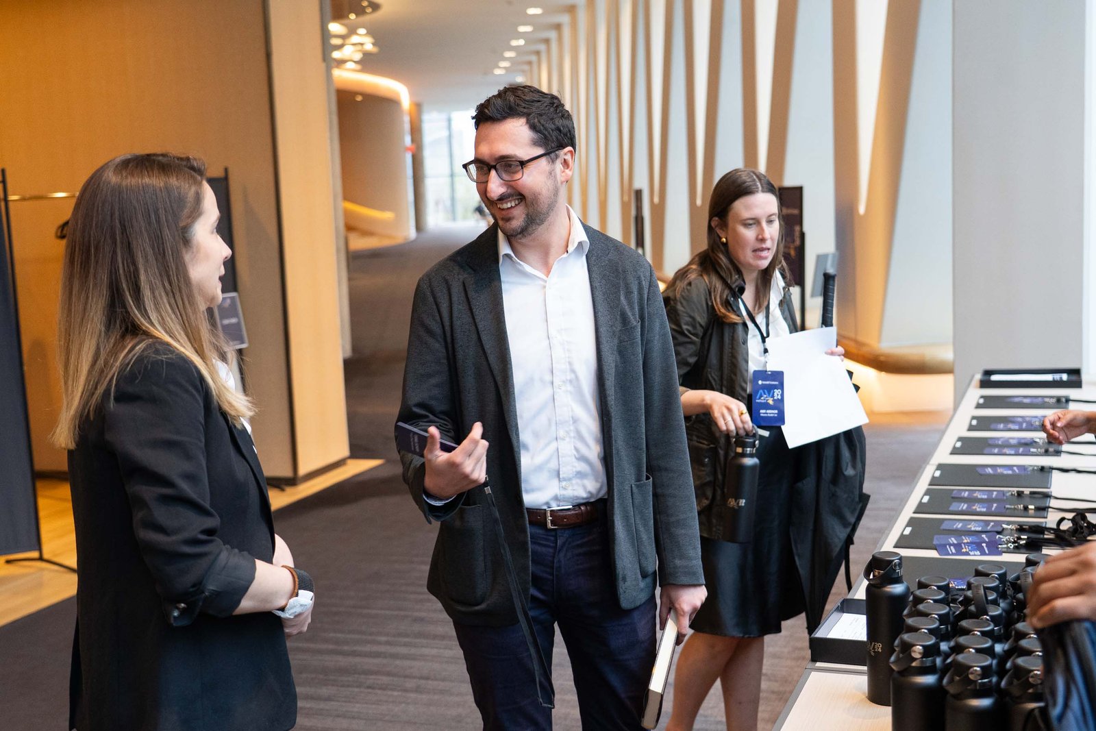 man checking in at arnold ventures conference