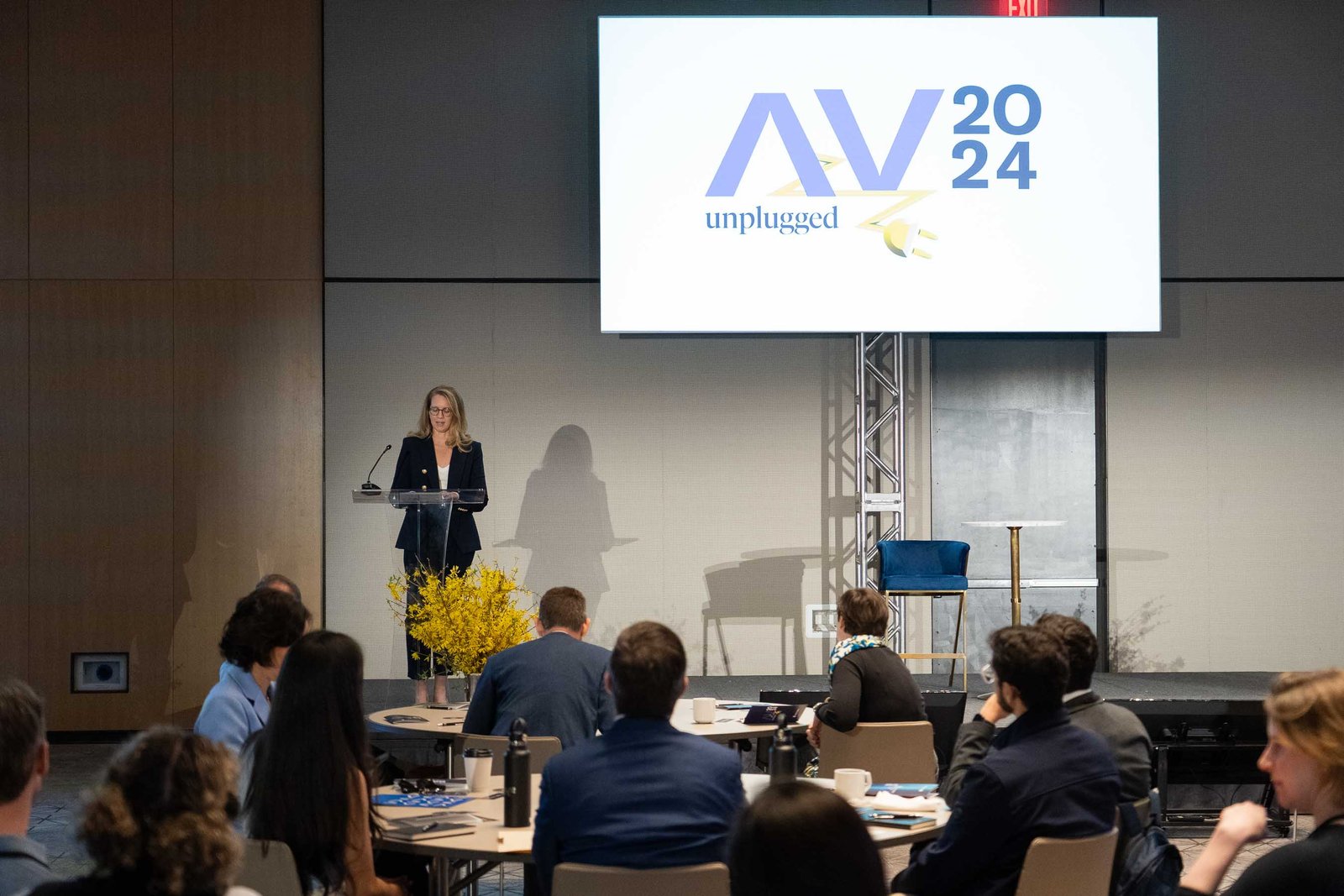 arnold ventures speaker on stage wide shot