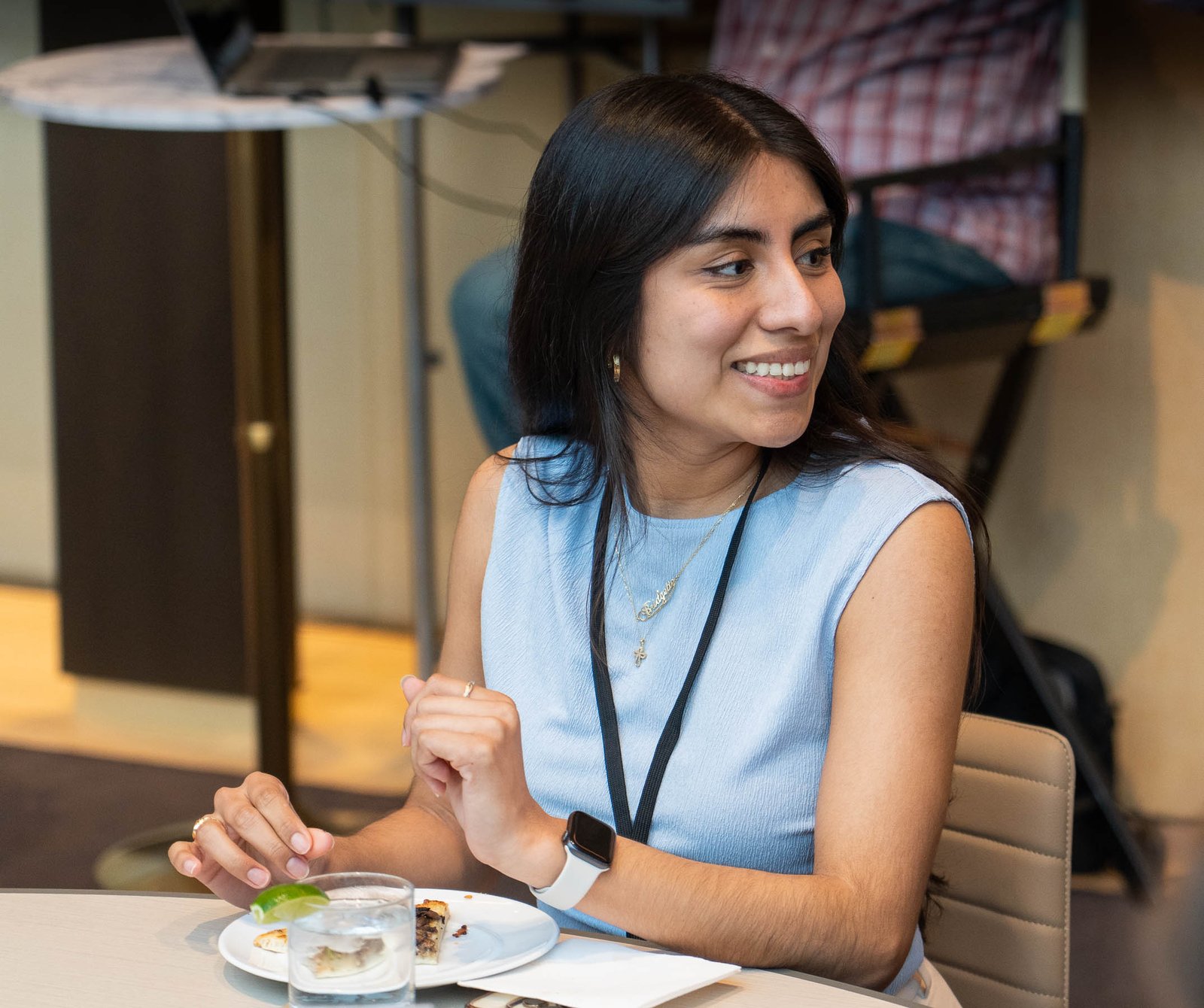 woman smiling at table sitting