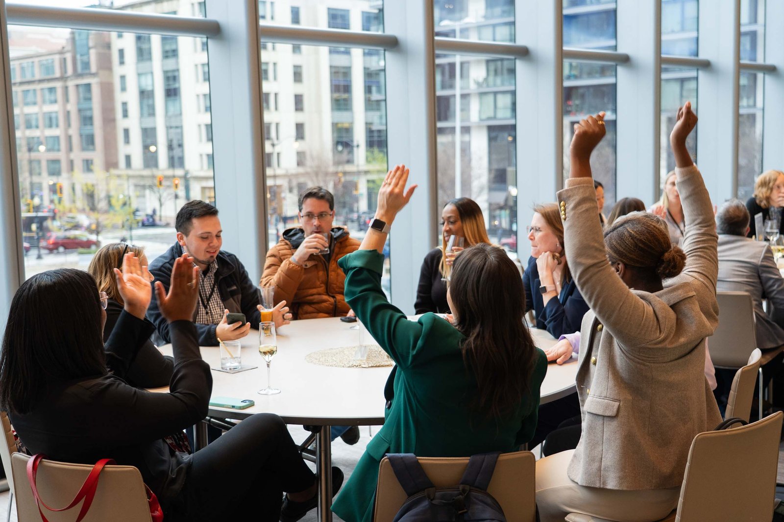 attendees raising hands