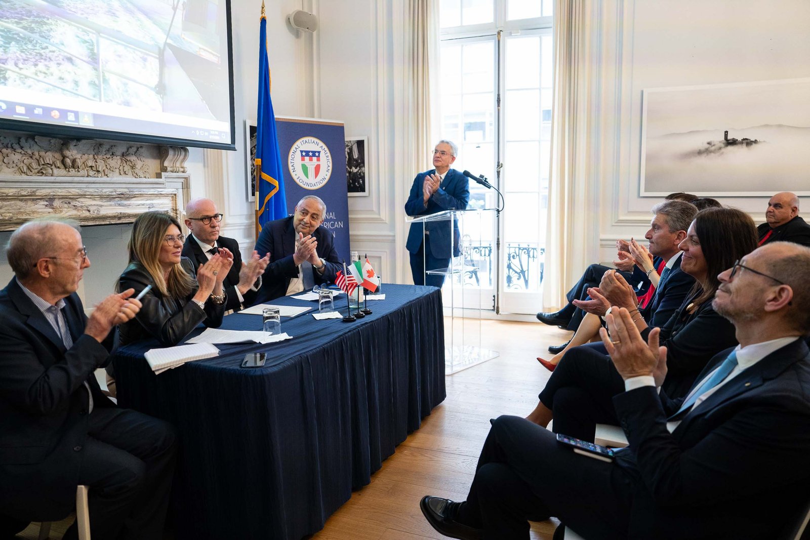 Panel seated at table with NIAF branding Italian Consulate Manhattan