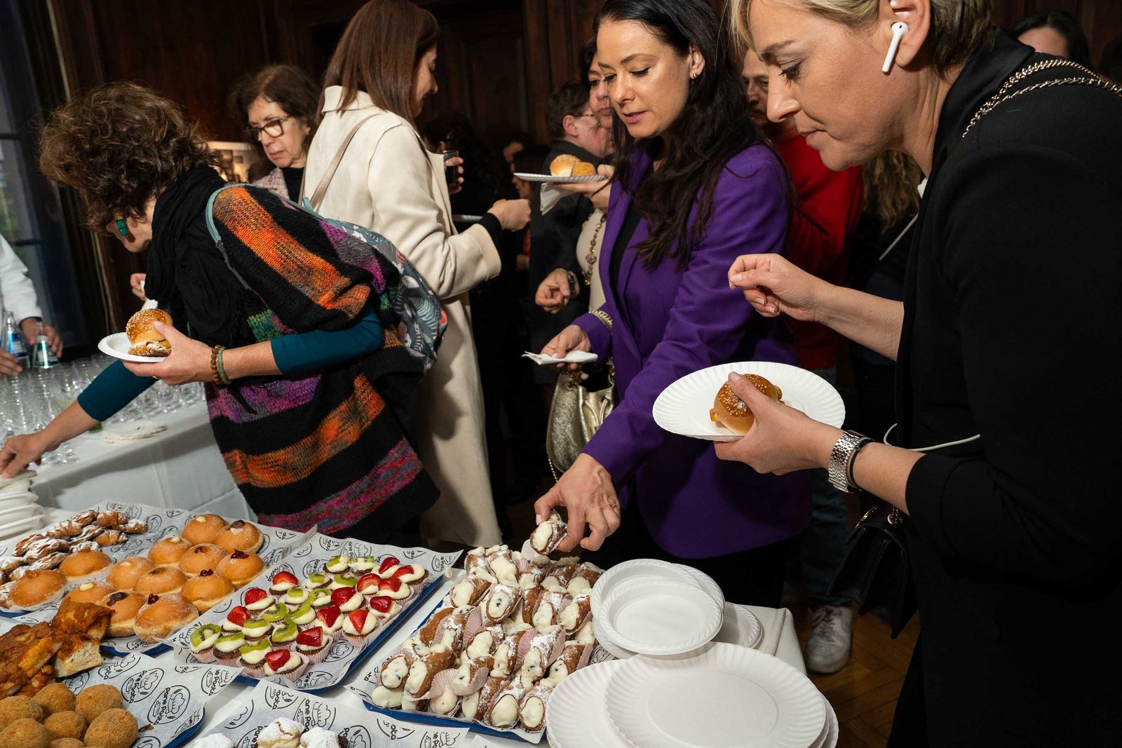 Guests at catering table NIAF Italian Consulate networking reception NYC