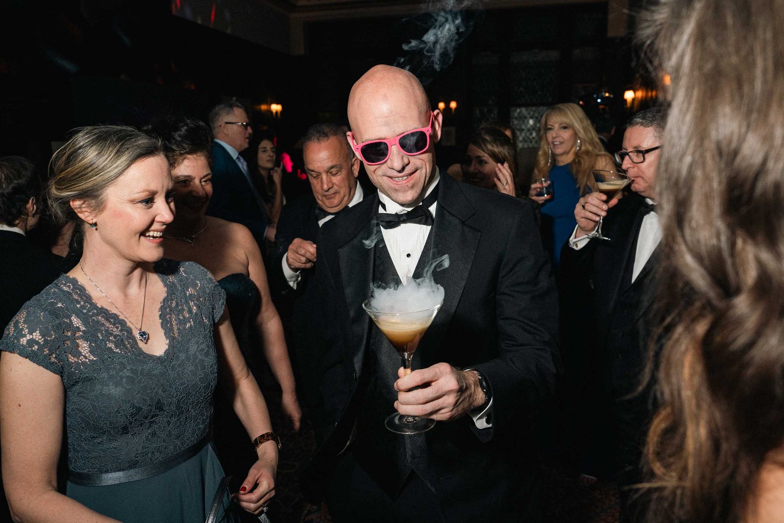 Guests with cocktails chatting at Sailor's Ball 2024 New York City