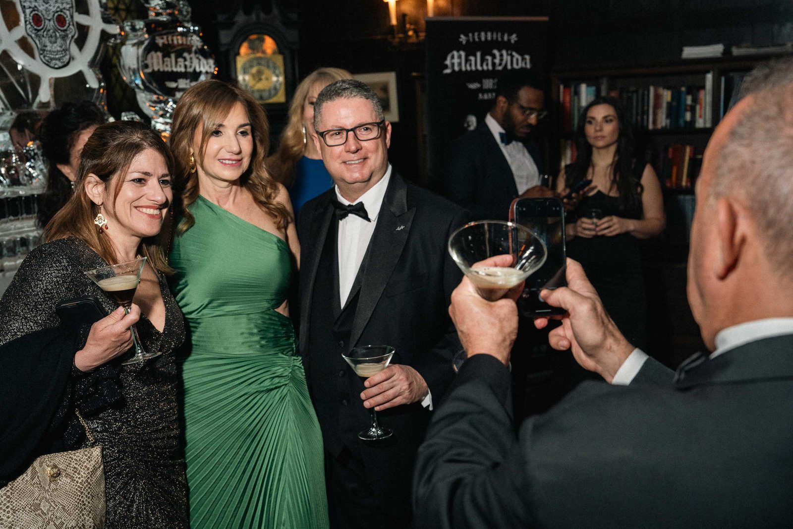 Guests mingling in elegant ballroom at Sailor's Ball 2024 New York City