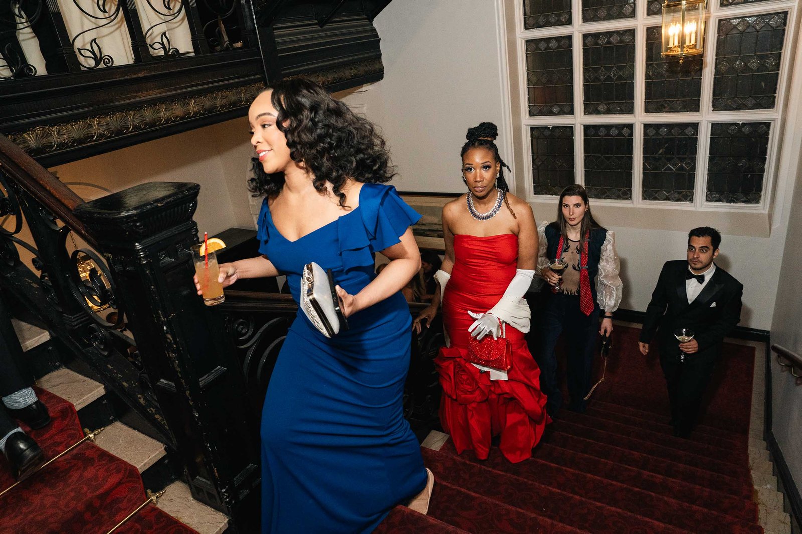 Woman in blue dress dancing at Sailor's Ball 2024 New York City event