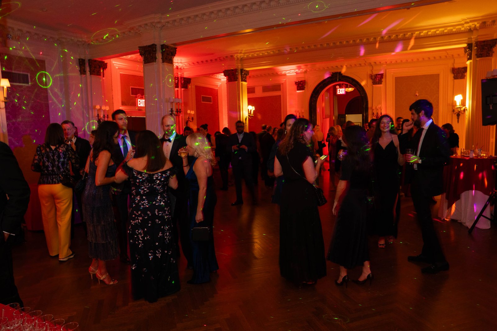 Ballroom atmosphere with red lighting at Sailor's Ball 2024 NYC gala