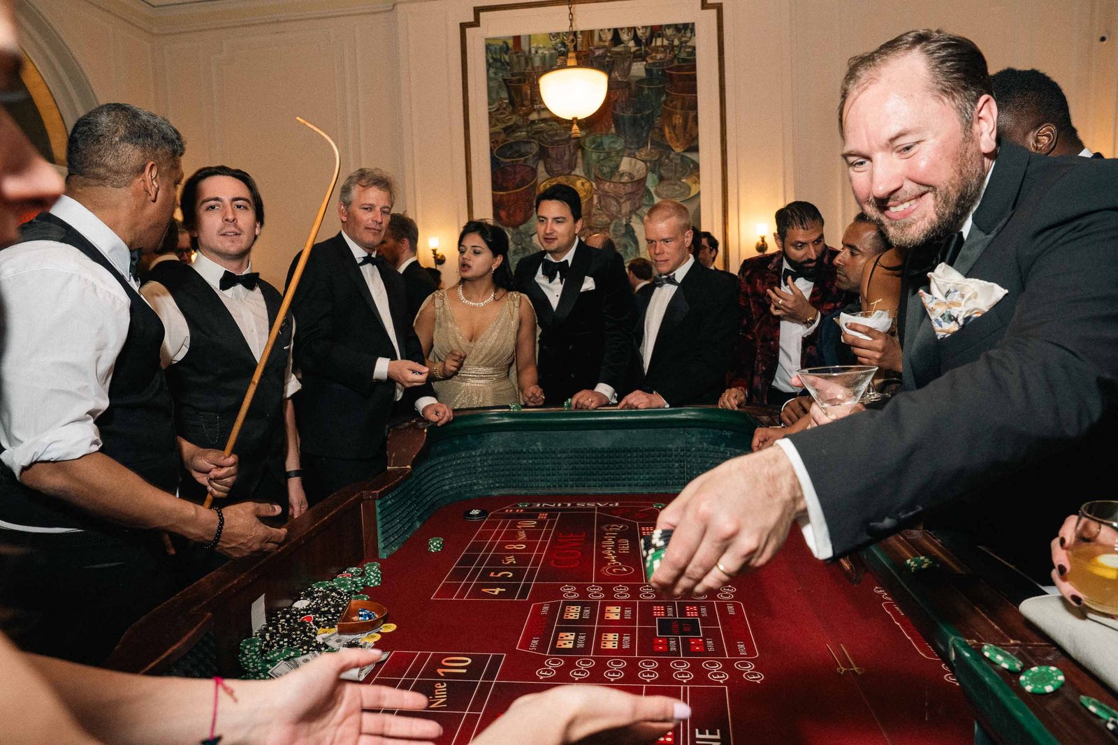 Guests at casino table late night at Sailor's Ball 2024 NYC