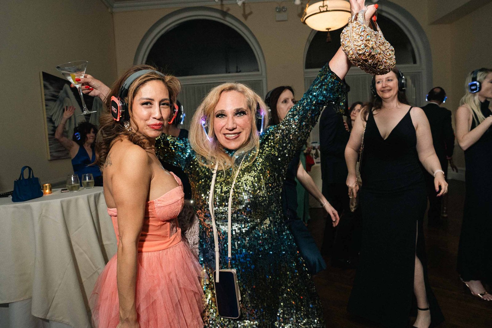 Woman in sequined gown celebrating at Sailor's Ball 2024 New York City