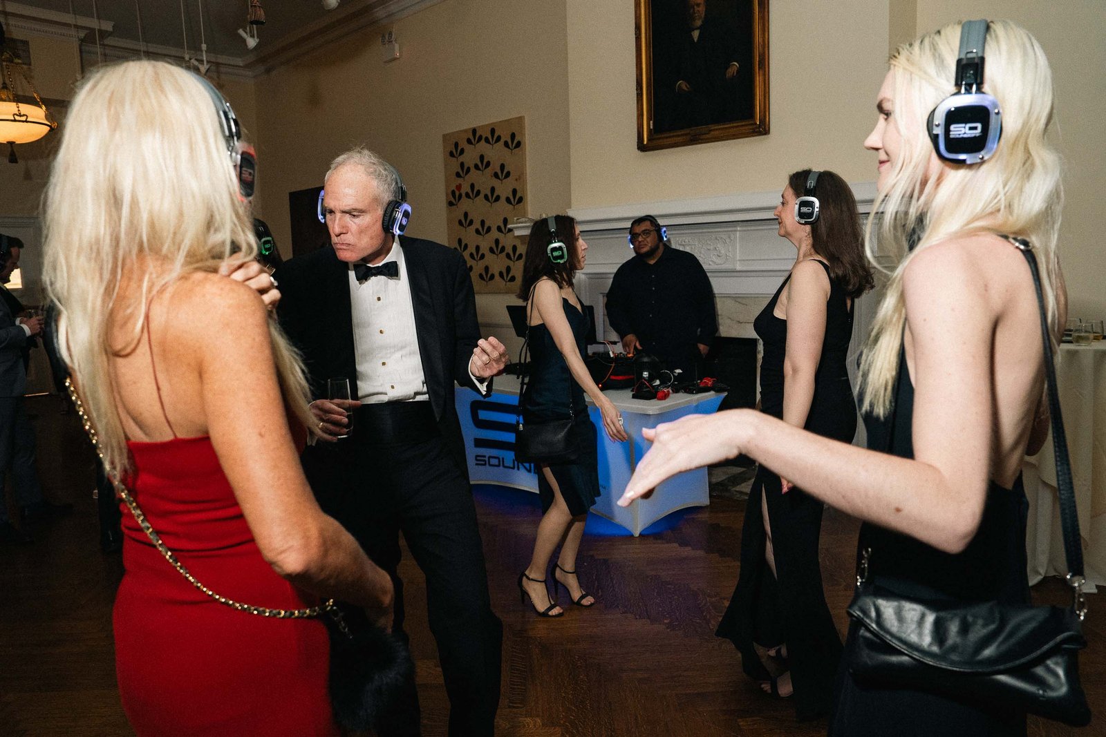 Woman in red dress dancing at Sailor's Ball 2024 New York City event