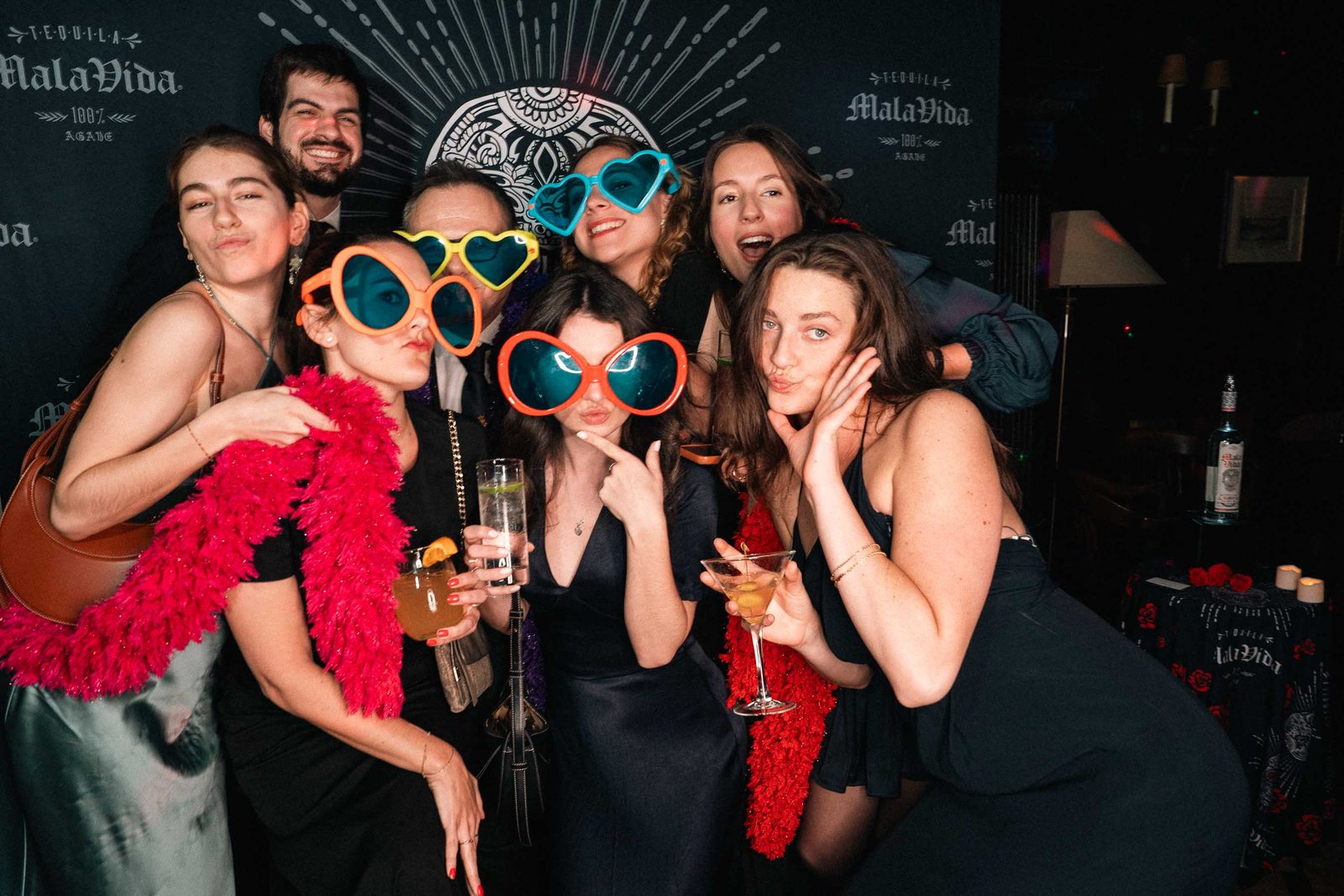 Group of guests with novelty glasses at Sailor's Ball 2024 NYC photo moment