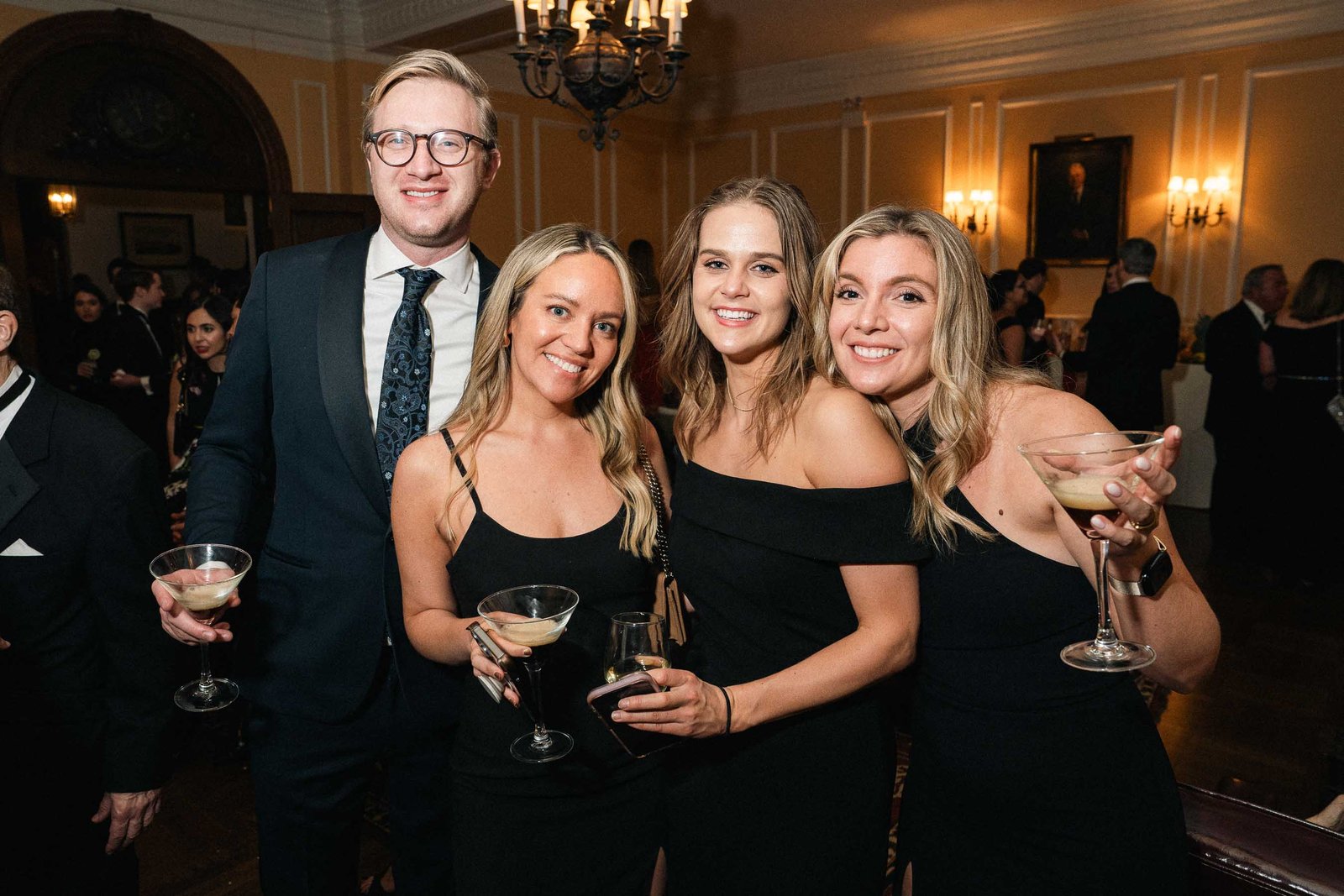 Couple with cocktails at Sailor's Ball 2024 New York City gala event