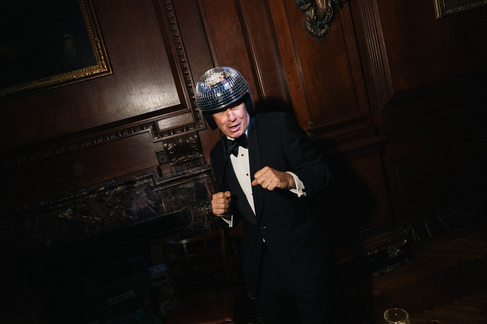 Guests in dark atmospheric ballroom at Sailor's Ball 2024 New York City