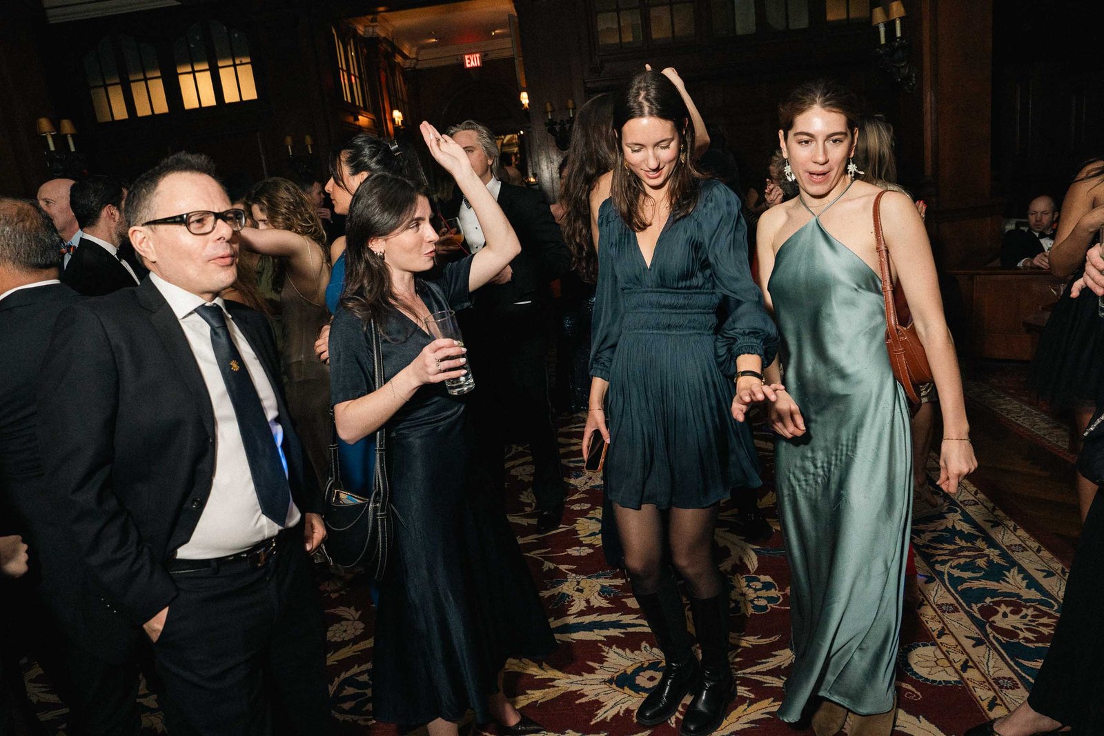 Man and women in teal gown at Sailor's Ball 2024 NYC gala
