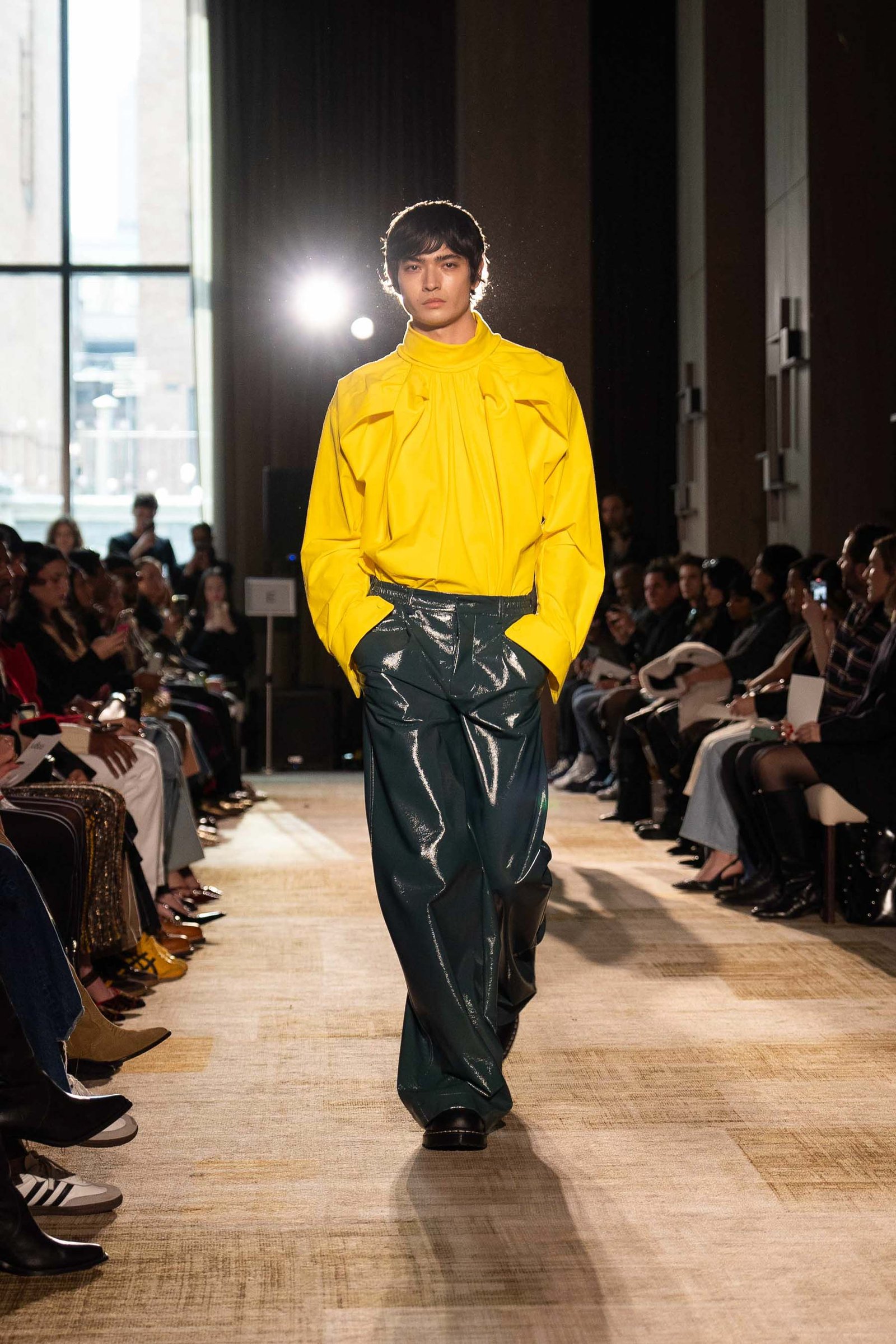 Aknvas runway model in yellow and dark green outfit NYFW
