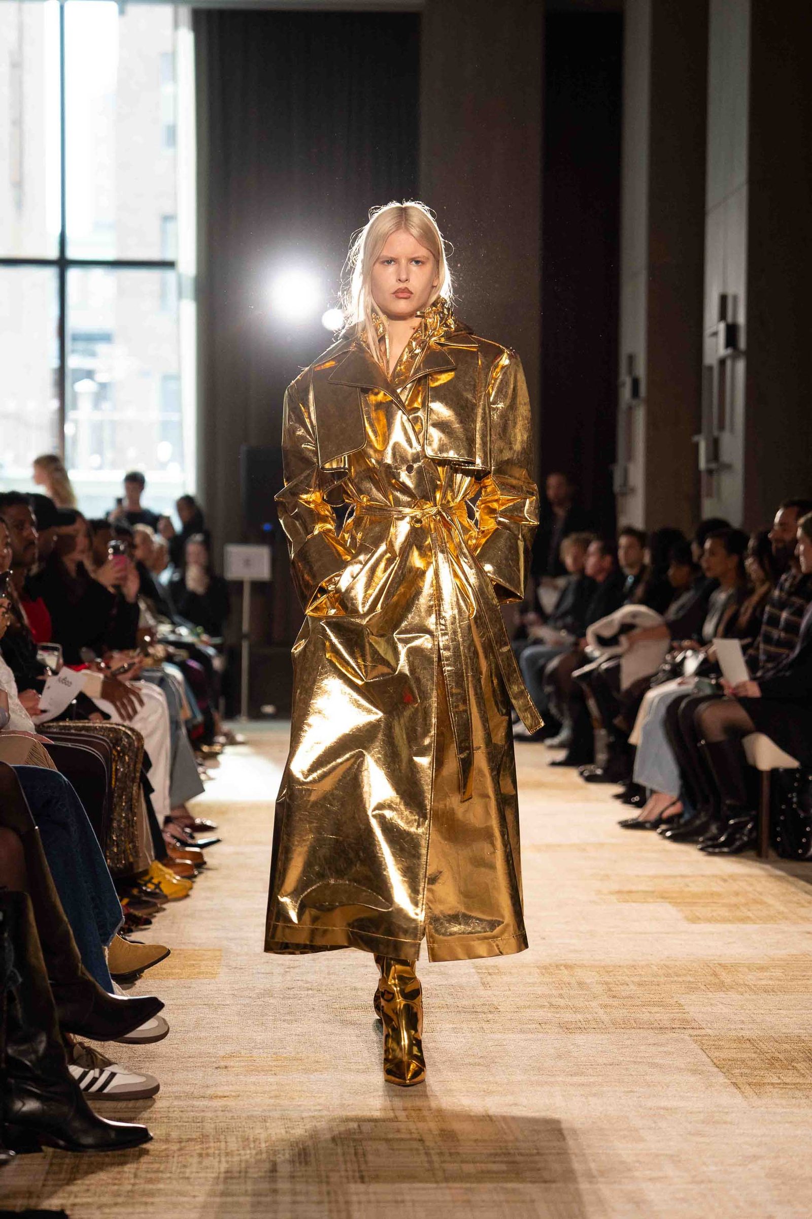 Aknvas runway model in gold metallic gown New York Fashion Week