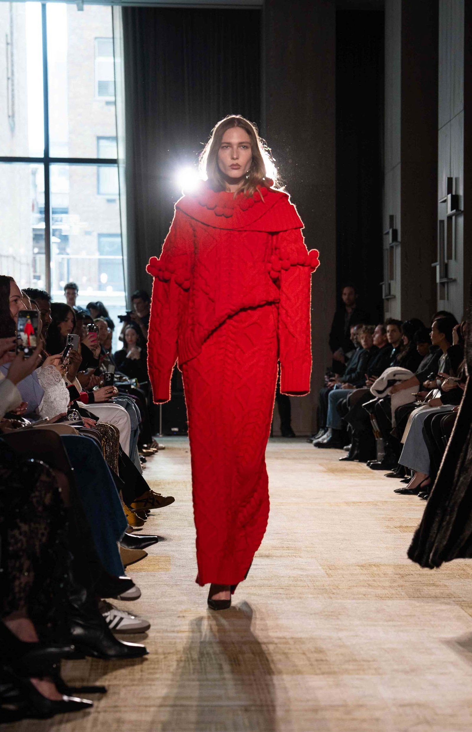 Aknvas runway model in red outfit NYFW New York City